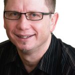 Every Real Estate agent needs a great head shot, but not everyone loves having their picture taken.  Knowing a fantastic portrait photographer, Kate Mahaits, made the process that much easier for John Deak.