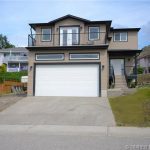 Enjoy spacious family living on a quiet street with a view and an in-law suite in this home in Vernon BC listed for sale by John Deak of Century 21.