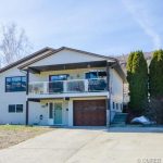 Great 3 bedroom, 2 bath family home with a big flat back yard and a great view listed for sale on quiet street in Coldstream, BC. John Deak Century 21