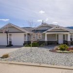 Executive 4 bedroom 3 bath home in Foothills has a commanding view of the valley and open concept kitchen. Listed for sale with John Deak of Century21 Vernon BC.