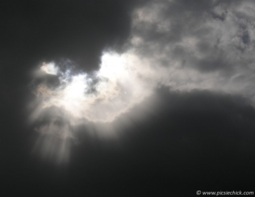 Sun shining through cloud over Vernon, BC