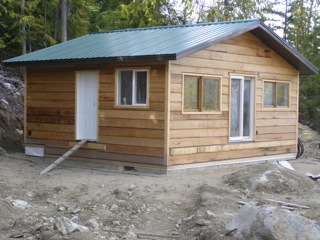 This property for sale by John Deak at 306 Lower Inonoaklin Rd, Edgewood BC includes this new cabin ready for your finishing touches.