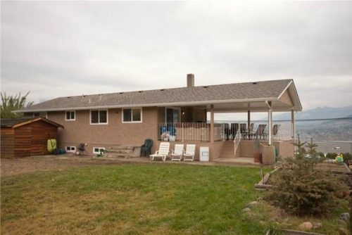 Lots of room for your dog in the fenced flat backyard on 0.3 acres with this home for sale by John Deak of Royal LaPage in Coldstream BC near Vernon BC