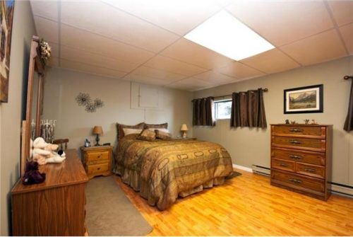 Large upgraded master bedroom in this BX home for sale in Vernon BC listed by John Deak of Royal LaPage