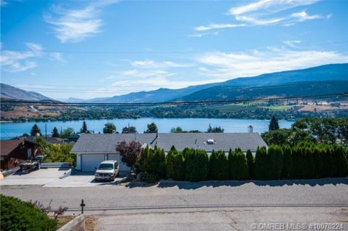 Family friendly 4 bed 2 bath home with huge Kal Lake views for sale in Coldstream BC by John Deak of Royal LaPage.