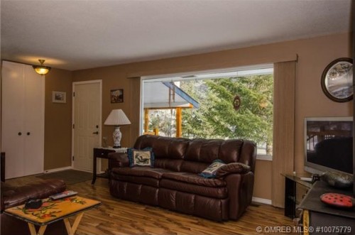 Updated laminate floors and bright rooms at 2176 Quesnel Road Lumby BC listed by John Deak of Royal LaPage.