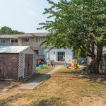 Flat, fenced back yard with patio at 1909 44 Street, Vernon BC