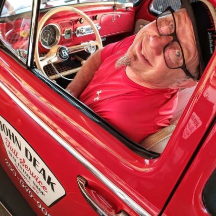 John Deak of Royal LePage Downtown Realty, your Seriously Fun Realtor® happily in the driver's seat of Beep Beep, the Little Red Beetle